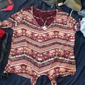 This is a No Boundaries Floral stripped Shirt. It is big on my but it is comfy